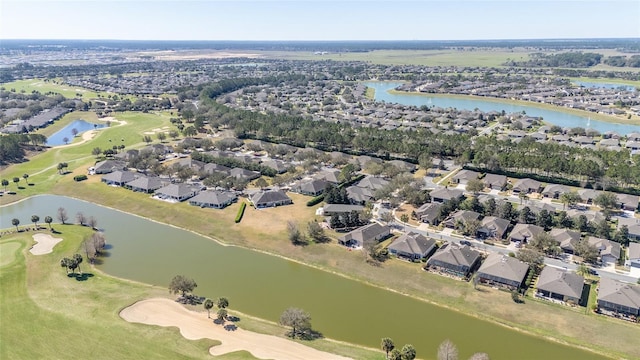 aerial view featuring a residential view, a water view, and golf course view