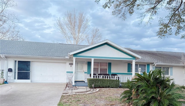 ranch-style house with covered porch and a garage