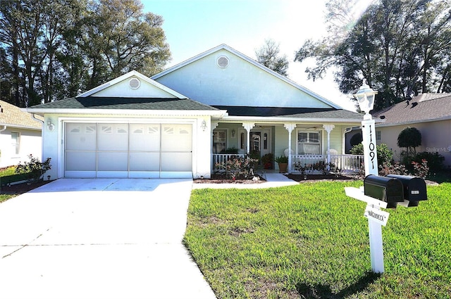 view of front of home featuring covered porch, driveway, a front lawn, and an attached garage