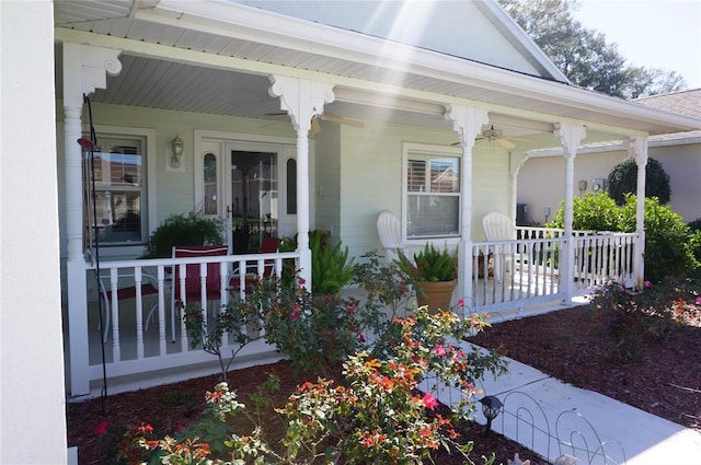 view of exterior entry featuring covered porch