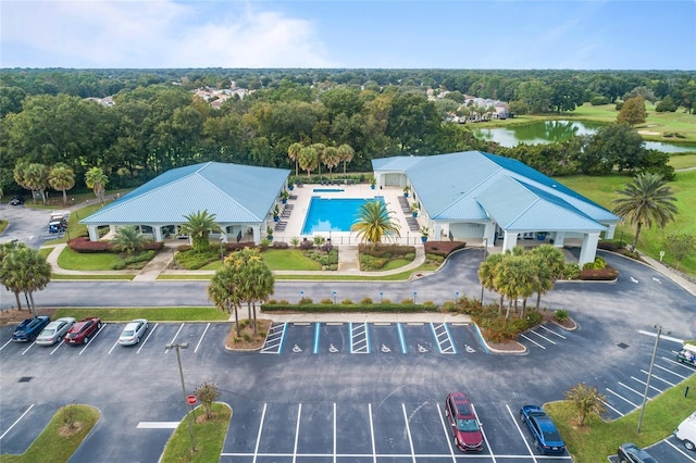 bird's eye view of a nearby body of water and a pool area