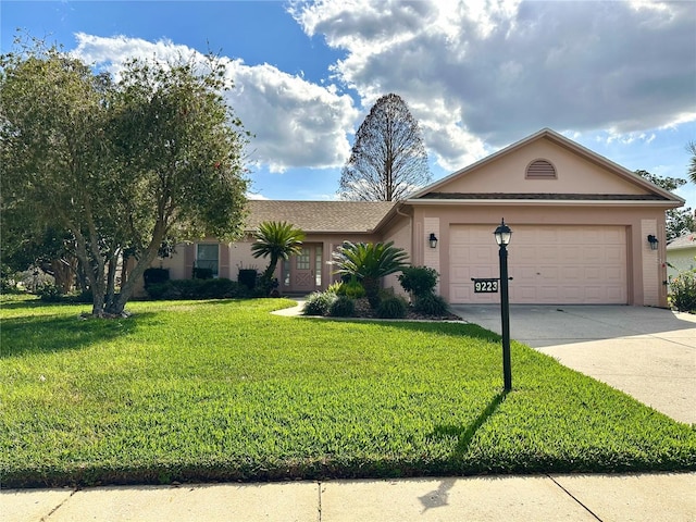 single story home with a front lawn and a garage