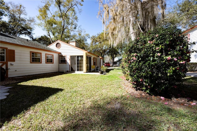 view of yard featuring a sunroom