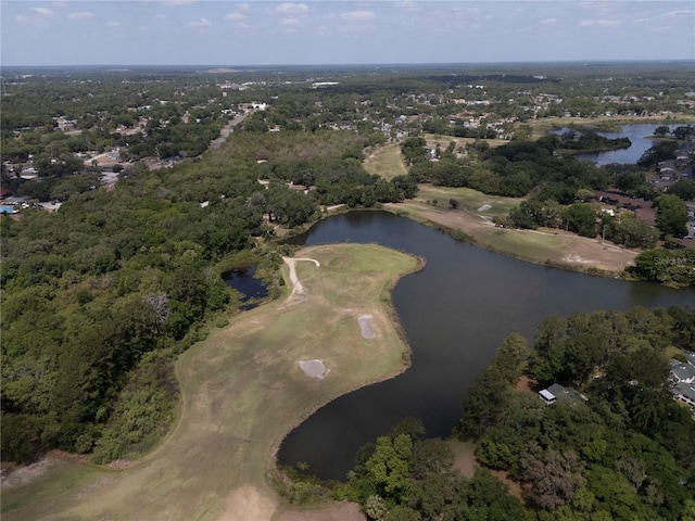 birds eye view of property with view of golf course and a water view