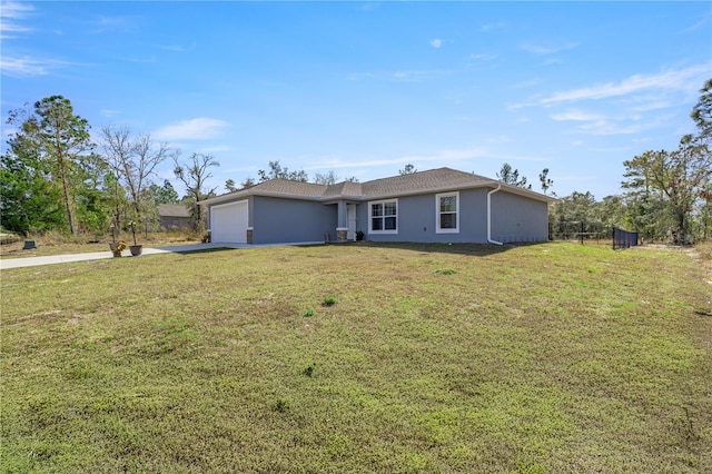 single story home with a front lawn and a garage