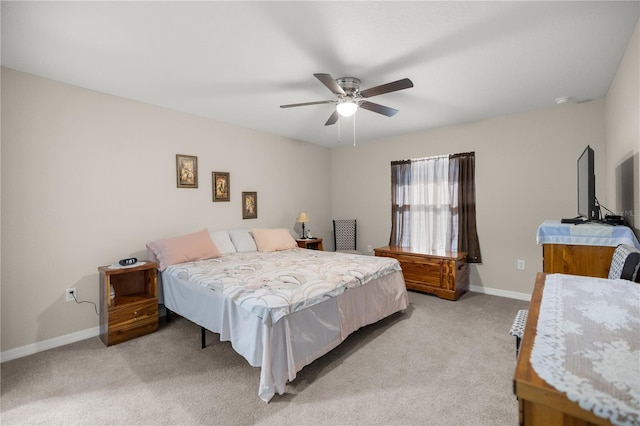 bedroom featuring ceiling fan and light colored carpet