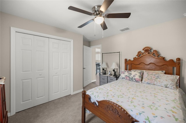 bedroom with carpet floors, a closet, and ceiling fan