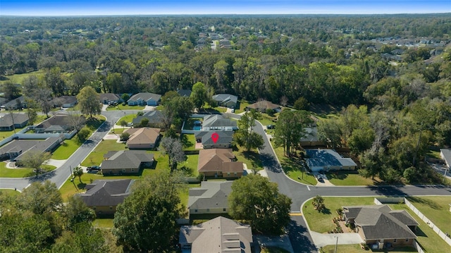 aerial view featuring a residential view and a wooded view