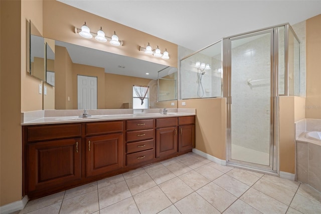 full bathroom featuring a garden tub, a sink, a shower stall, and double vanity