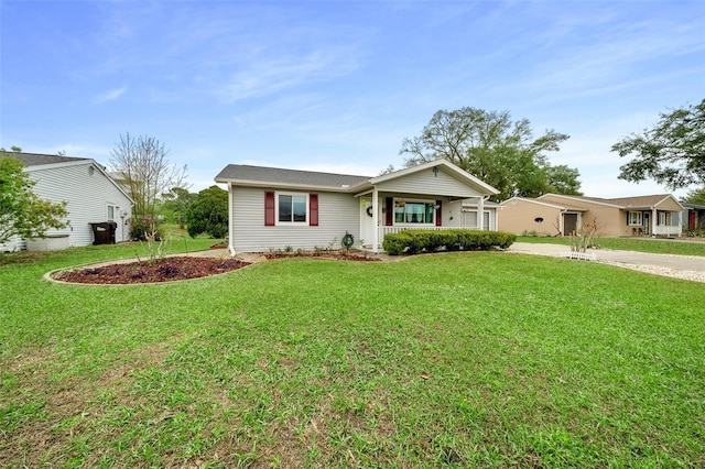 ranch-style home with covered porch and a front yard