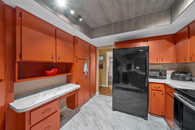 kitchen featuring built in study area, marble finish floor, light countertops, black appliances, and open shelves