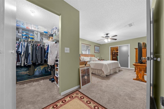 bedroom featuring visible vents, a closet, and light colored carpet