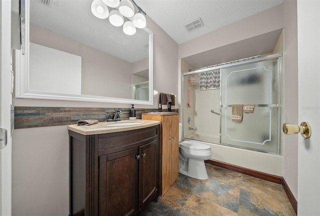 bathroom with shower / bath combination with glass door, visible vents, toilet, vanity, and a textured ceiling