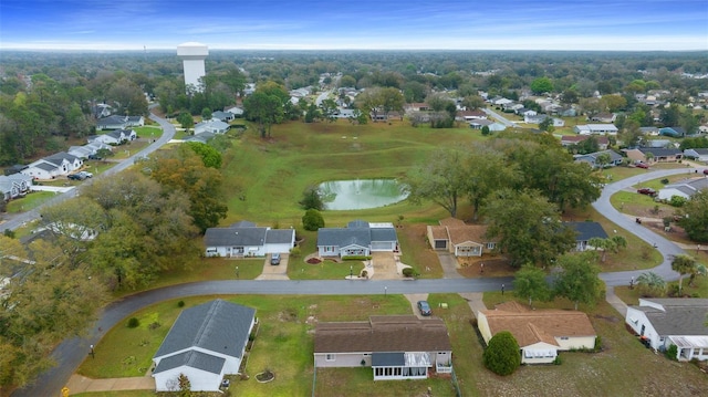 bird's eye view featuring a water view and a residential view