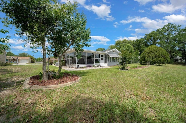 view of yard with a sunroom