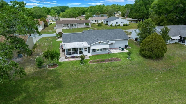 birds eye view of property with a residential view