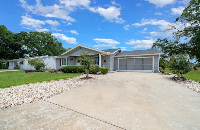 ranch-style house with a front yard, an attached garage, and driveway