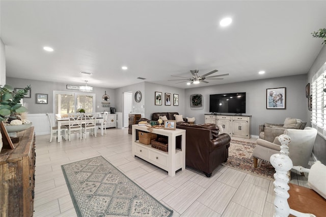 living area with ceiling fan, visible vents, and recessed lighting