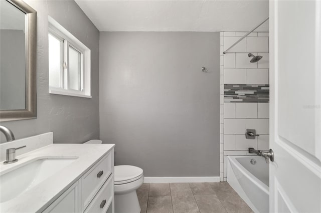 bathroom featuring baseboards, toilet, tile patterned floors, bathtub / shower combination, and vanity