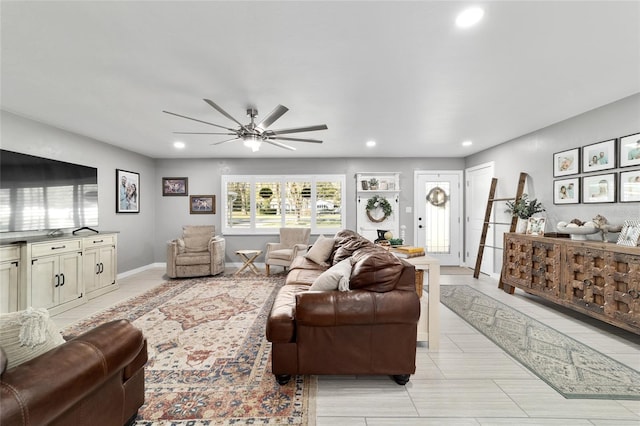 living area featuring recessed lighting, ceiling fan, and baseboards