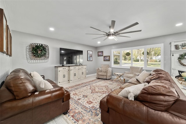 living area with ceiling fan, baseboards, and recessed lighting