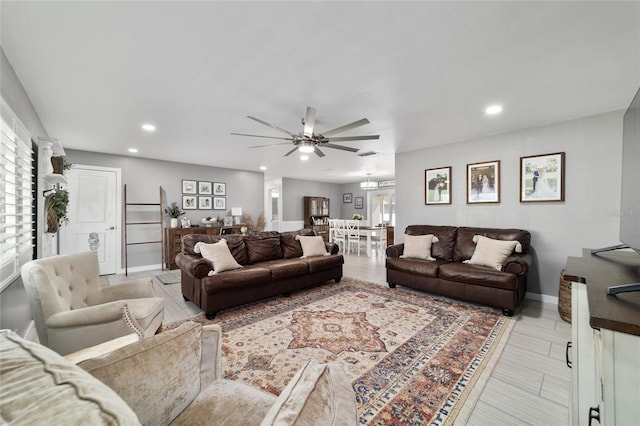 living area featuring recessed lighting, a healthy amount of sunlight, and baseboards