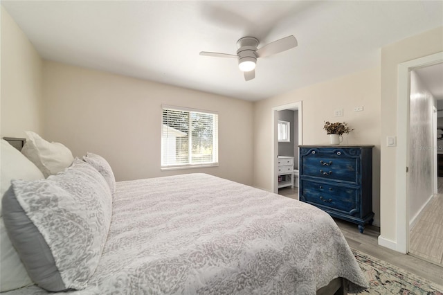 bedroom featuring baseboards, a ceiling fan, and wood finished floors