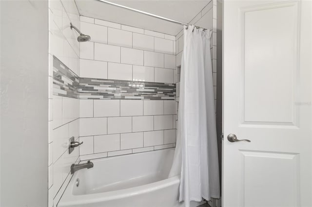 bathroom featuring shower / bath combo with shower curtain