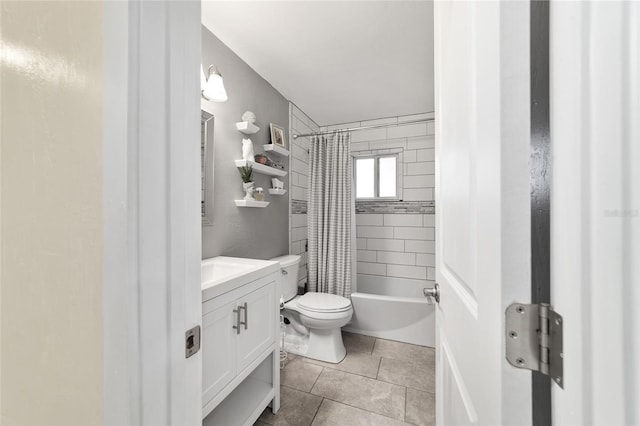 bathroom with tile patterned flooring, vanity, toilet, and shower / bath combo with shower curtain