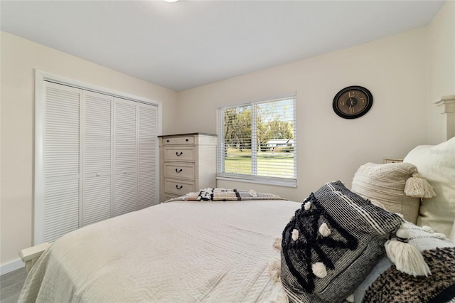 bedroom featuring a closet and baseboards