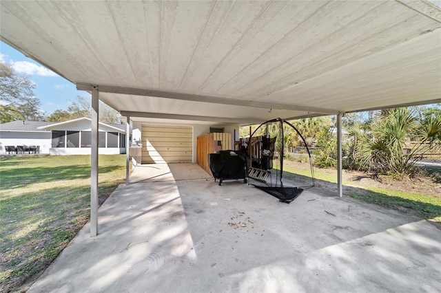 view of patio featuring a sunroom