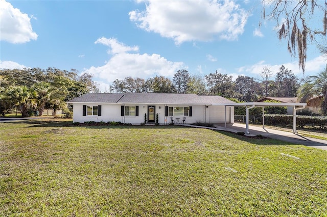 ranch-style house with an attached carport, concrete driveway, and a front lawn