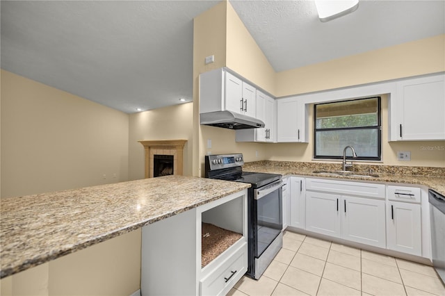 kitchen featuring white cabinets, appliances with stainless steel finishes, light stone countertops, under cabinet range hood, and a sink