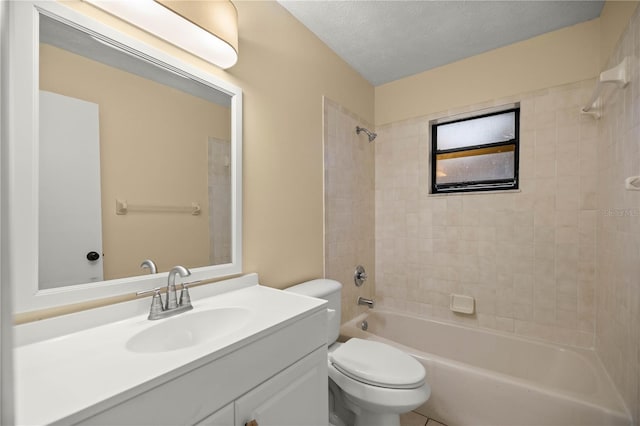 full bath featuring toilet, bathtub / shower combination, a textured ceiling, and vanity