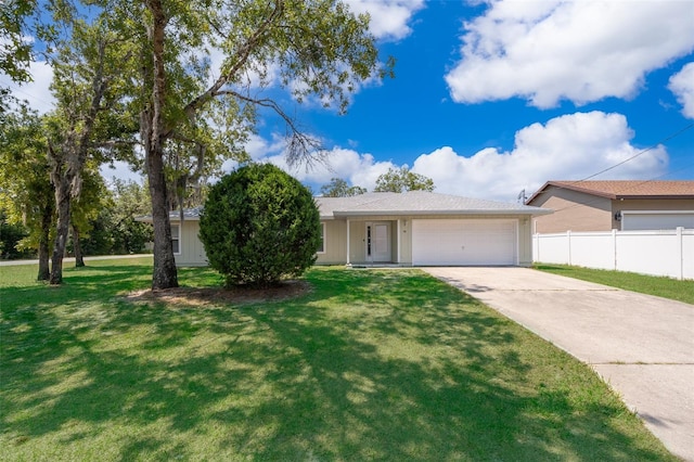 view of front facade with a front yard and a garage