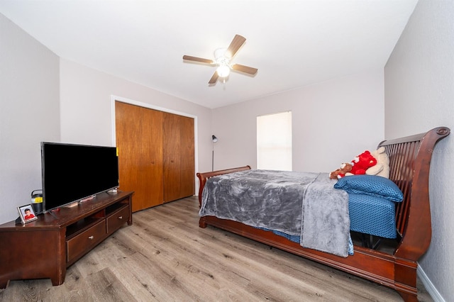 bedroom with ceiling fan and light wood-type flooring