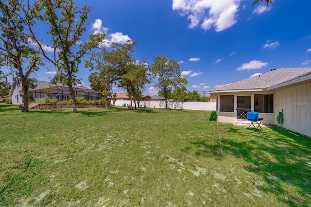 view of yard with a sunroom