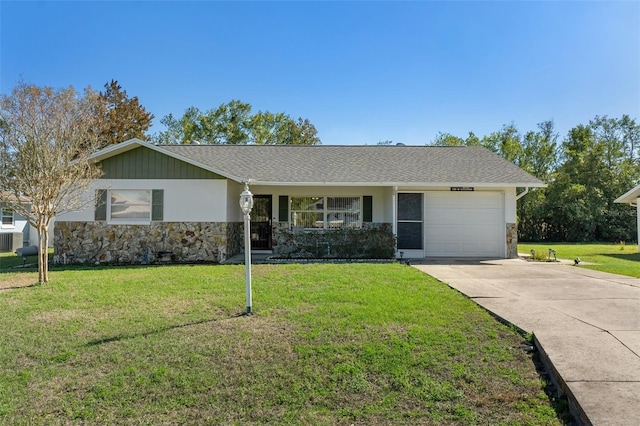 ranch-style house featuring a garage and a front lawn