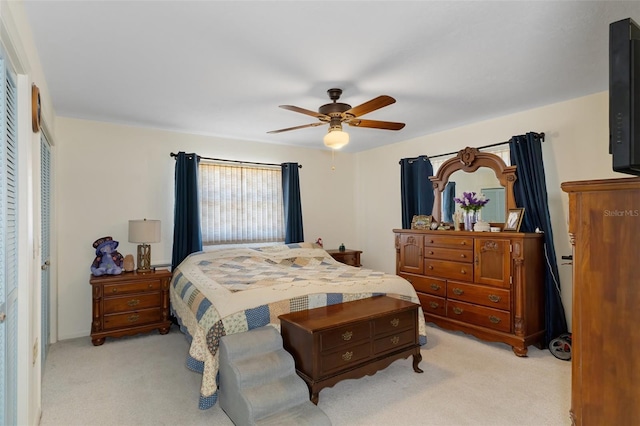 bedroom featuring a closet, ceiling fan, and light colored carpet