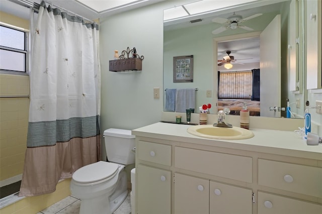 bathroom featuring vanity, toilet, and walk in shower