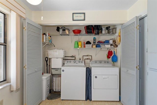 laundry area with independent washer and dryer