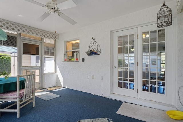 interior space featuring ceiling fan and french doors