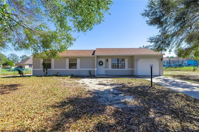 ranch-style home featuring a garage