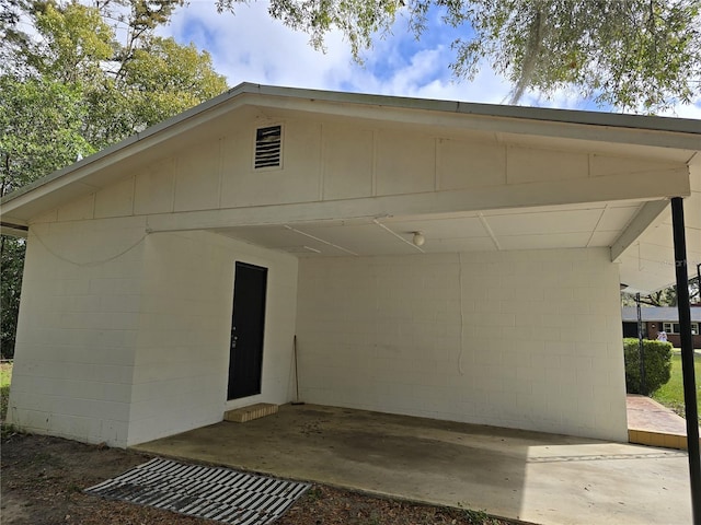 exterior space with concrete block siding