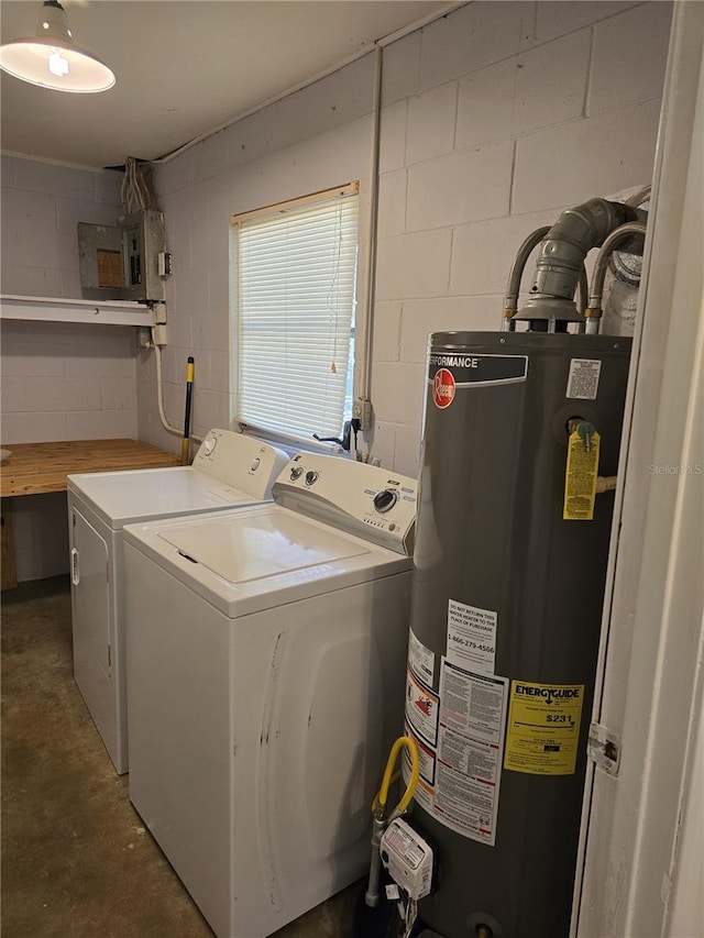 washroom featuring concrete block wall, laundry area, electric panel, washer and clothes dryer, and water heater