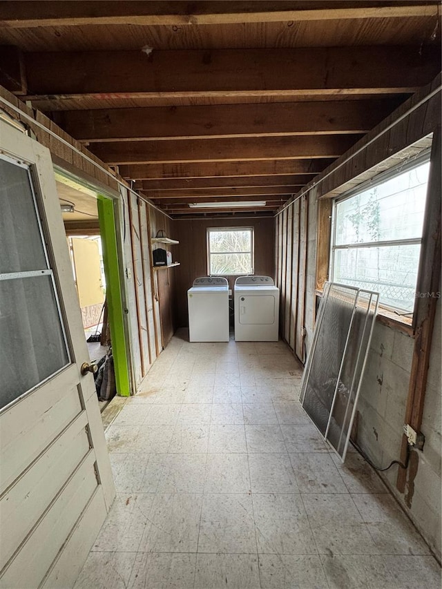 below grade area featuring light floors and independent washer and dryer