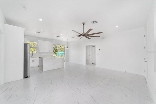 interior space featuring marble finish floor, a ceiling fan, visible vents, and recessed lighting