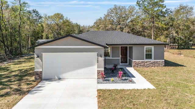 single story home with stucco siding, a front yard, a garage, stone siding, and driveway