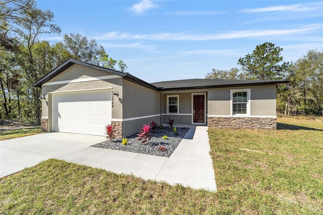 single story home featuring stucco siding, an attached garage, a front yard, stone siding, and driveway