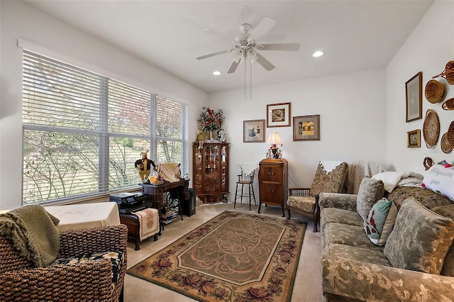 living area with carpet, a ceiling fan, and recessed lighting